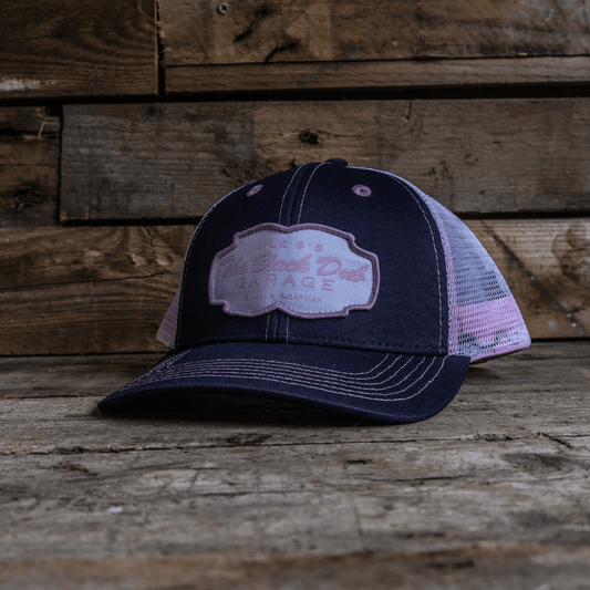 Pink & Navy Garage Trucker Hat by Uggly & Co