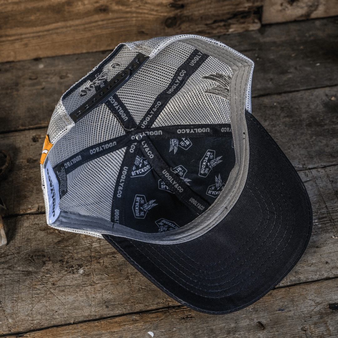 Mile 9 Spark Plug Wings Trucker Hat by Uggly & Co